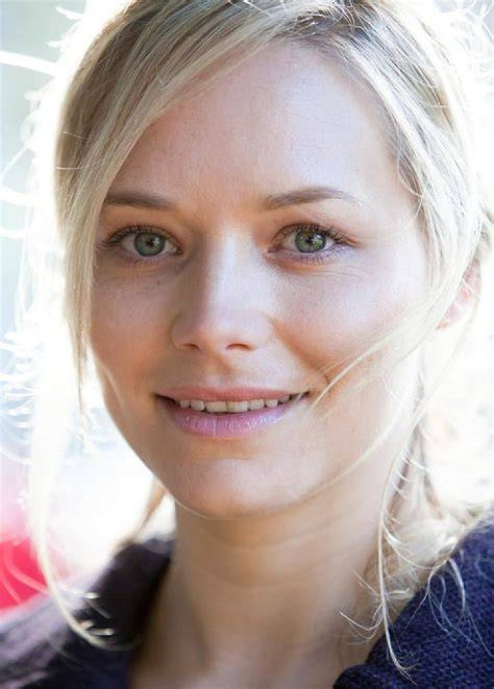 Actress, Adrienne Pickering giving a pose in an event.