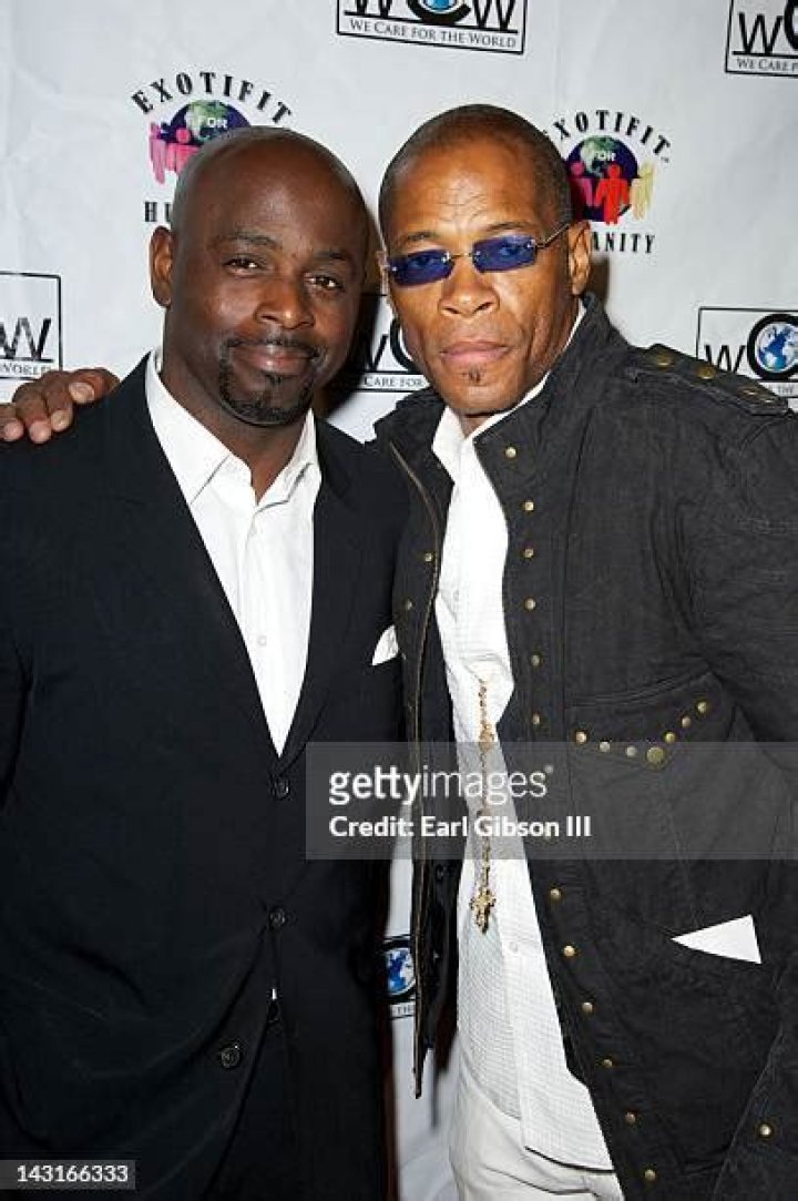 Alimi Ballard giving a pose along with his wife, Dahn Elle Dior Ballard.
