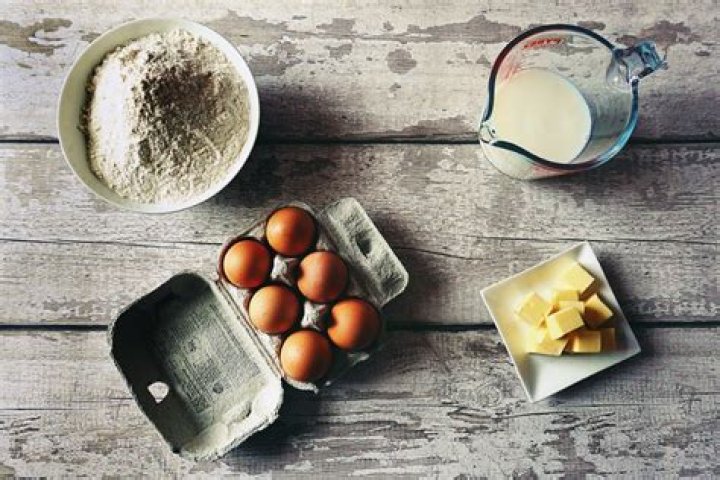 Butter, egg, flour in a stainless bowl.