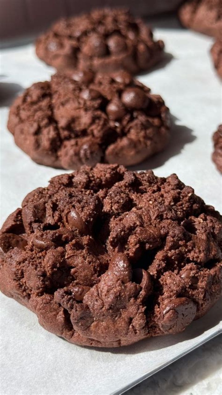 Chocolate chip cookies on parchment paper.
