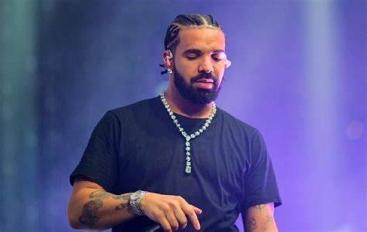 Drake's post on Instagram where(left) Sade and Drake hugged each other while posing for the camera