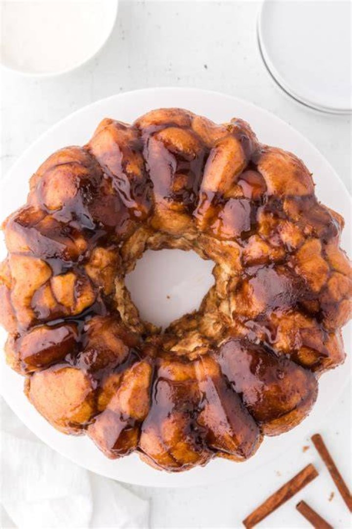 Overhead shot of money bread topped with pecans. 