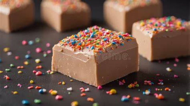Piece of fudge topped with marshmallows and crushed candy canes.