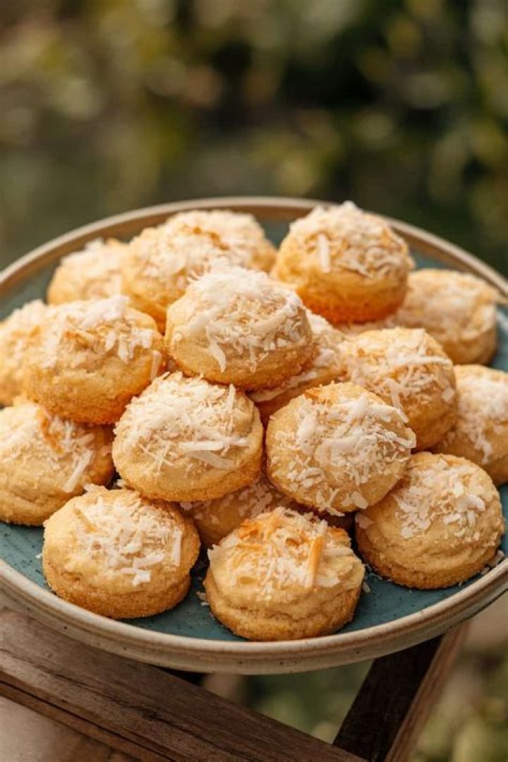 Sugar cookies topped with coconut and egg shaped candies. 