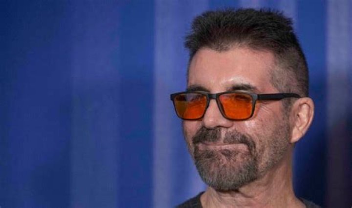 What's the Reason Behind Simon Cowell Wearing Red Tinted Glasses? Who Exactly is Simon Cowell? - SarkariResult